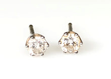 A Pair of 14 Karat Yellow Gold Estate Diamond Stud Earrings