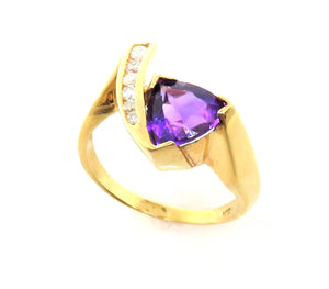 14 Karat Yellow gold Amethyst and Diamond Bypass Design Fashion Ring
