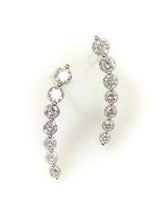 A Pair of 14 Karat White Gold Curvred Diammond stick Style Earrings