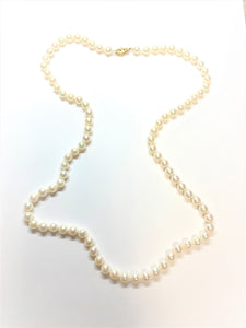 Estated Single Strand Of Cultured Pearls with a 14 Karat Yellow Gold Filigree Pearl Clasp